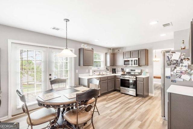 1194 Grandview Cir, Powder Springs, GA 30127 - dining space with light wood-style floors, french doors, recessed lighting, and baseboards