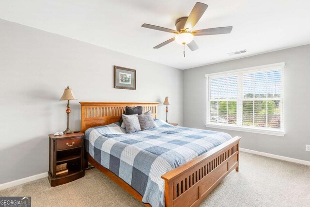 1194 Grandview Cir, Powder Springs, GA 30127 - carpeted bedroom featuring baseboards and ceiling fan