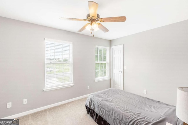 1194 Grandview Cir, Powder Springs, GA 30127 - carpeted bedroom with baseboards and ceiling fan