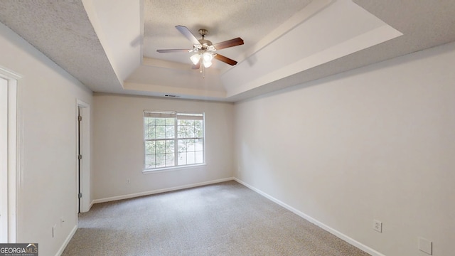 4162 Ward Lake Trl, Ellenwood, GA 30294 - carpeted spare room featuring a tray ceiling, ceiling fan, and baseboards