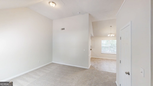 4162 Ward Lake Trl, Ellenwood, GA 30294 - spare room with a chandelier, lofted ceiling, carpet flooring, and baseboards
