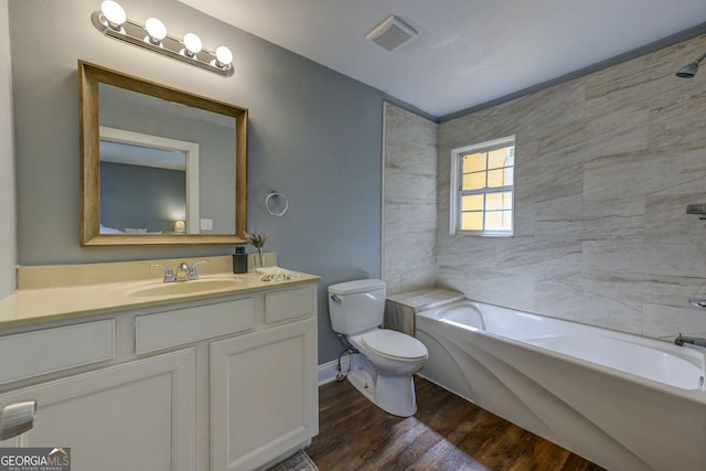 103 Chicamauga Ave SW, Atlanta, GA 30314 - full bath featuring toilet, vanity, wood finished floors, shower / washtub combination, and baseboards