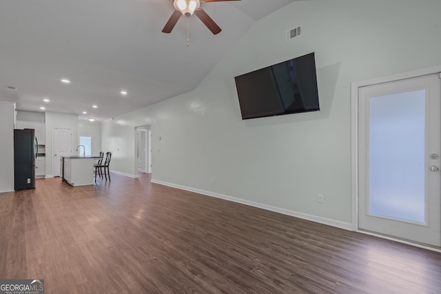 385 Orchard Land, Covington, GA 30014 - unfurnished living room featuring ceiling fan, dark wood-style floors, recessed lighting, a sink, and lofted ceiling