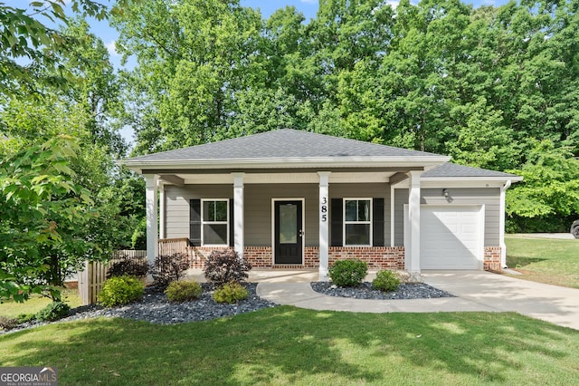 385 Orchard Land, Covington, GA 30014 - view of front of home featuring brick siding, a garage, a porch, and concrete driveway