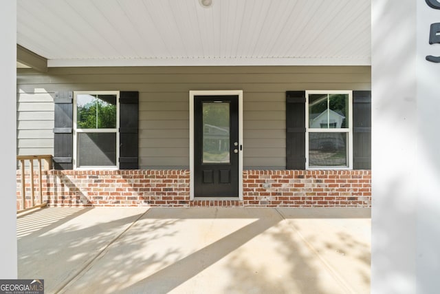 385 Orchard Land, Covington, GA 30014 - property entrance featuring brick siding and covered porch
