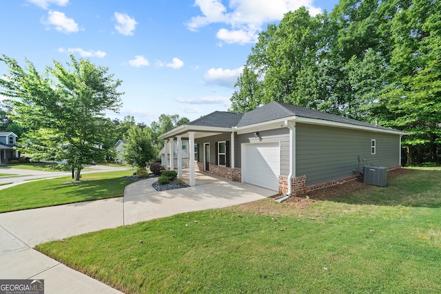 385 Orchard Land, Covington, GA 30014 - view of front of property with a front lawn, an attached garage, concrete driveway, central air condition unit, and roof with shingles