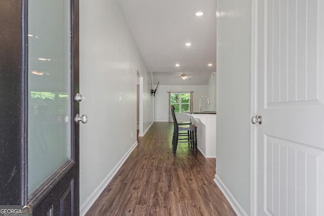 385 Orchard Land, Covington, GA 30014 - hallway with dark wood-style flooring, baseboards, recessed lighting, and a sink