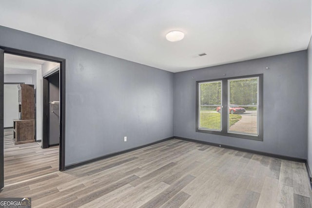 430 Pilgrim Ln, Powder Springs, GA 30127 - unfurnished room with light wood finished floors and baseboards