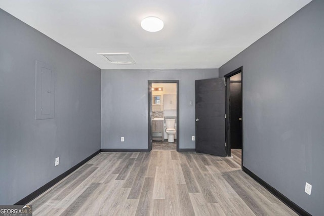 430 Pilgrim Ln, Powder Springs, GA 30127 - unfurnished bedroom featuring wood finished floors, electric panel, and ensuite bathroom