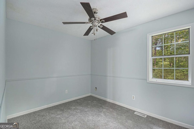 430 Pilgrim Ln, Powder Springs, GA 30127 - empty room with carpet, baseboards, and a ceiling fan