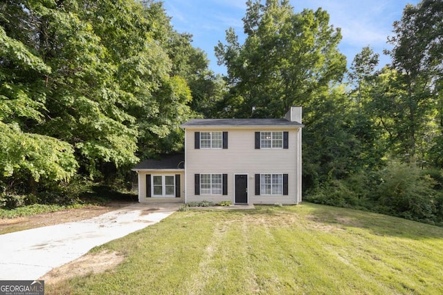 430 Pilgrim Ln, Powder Springs, GA 30127 - colonial inspired home with a chimney, a front yard, and driveway