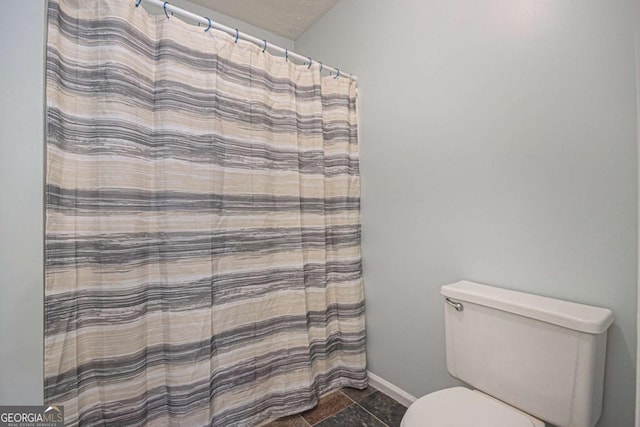 430 Pilgrim Ln, Powder Springs, GA 30127 - full bath with toilet, baseboards, curtained shower, and tile patterned flooring