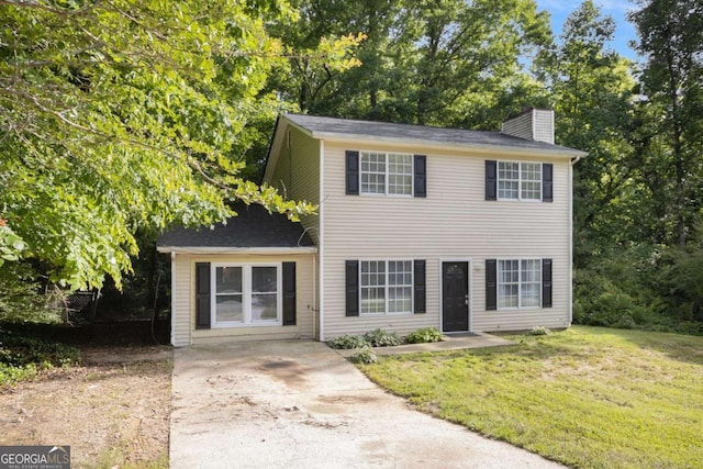 430 Pilgrim Ln, Powder Springs, GA 30127 - view of front of home with a chimney, a front yard, and driveway