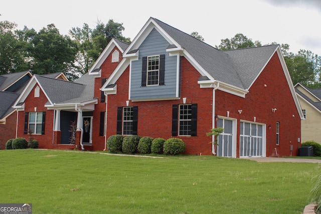 traditional home featuring concrete driveway, a front lawn, brick siding, central air condition unit, and an attached garage