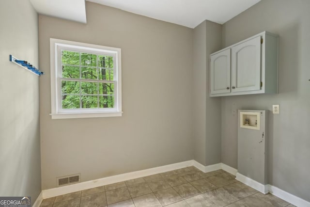 10660 Dunoon Dr, Alpharetta, GA 30022 - laundry area featuring cabinet space, hookup for a washing machine, and baseboards