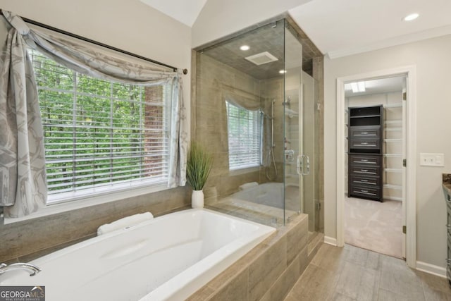 10660 Dunoon Dr, Alpharetta, GA 30022 - bathroom featuring a shower stall, a bath, healthy amount of natural light, and recessed lighting