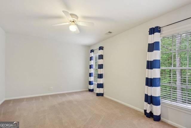 10660 Dunoon Dr, Alpharetta, GA 30022 - carpeted spare room with healthy amount of natural light, baseboards, and a ceiling fan