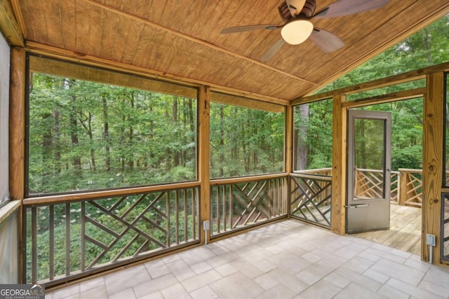 10660 Dunoon Dr, Alpharetta, GA 30022 - unfurnished sunroom with a ceiling fan, vaulted ceiling, and a view of trees