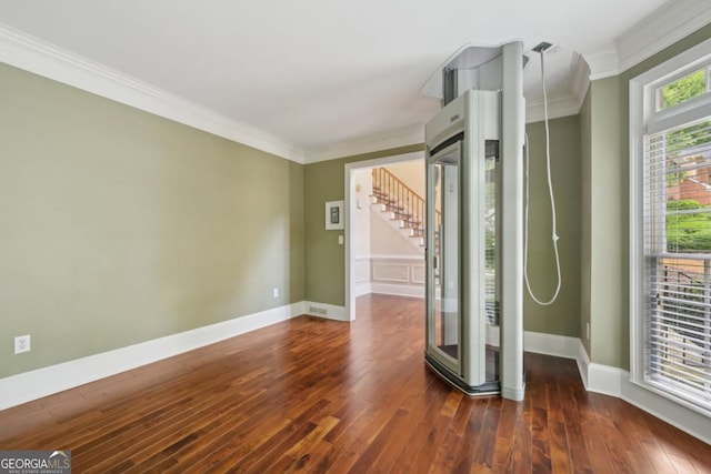 10660 Dunoon Dr, Alpharetta, GA 30022 - unfurnished room featuring crown molding, wood-type flooring, baseboards, and stairway