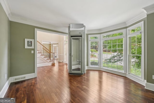 10660 Dunoon Dr, Alpharetta, GA 30022 - spare room featuring ornamental molding, dark wood finished floors, stairs, and baseboards