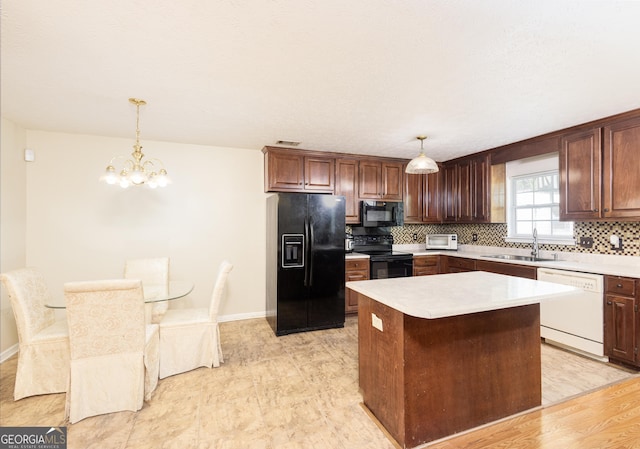 558 Wilder Dr, Columbus, GA 31907 - kitchen featuring black appliances, a sink, tasteful backsplash, a chandelier, and light countertops