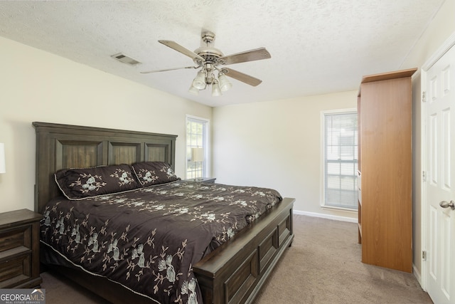 558 Wilder Dr, Columbus, GA 31907 - bedroom with carpet flooring, ceiling fan, baseboards, and a textured ceiling