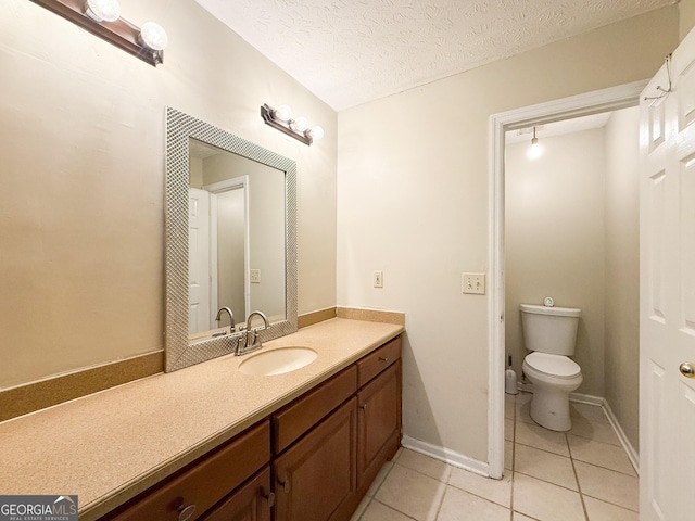 558 Wilder Dr, Columbus, GA 31907 - bathroom featuring tile patterned flooring, toilet, vanity, and a textured ceiling
