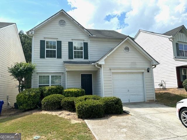 9515 Lakeview Rd, Union City, GA 30291 - traditional home featuring an attached garage and driveway