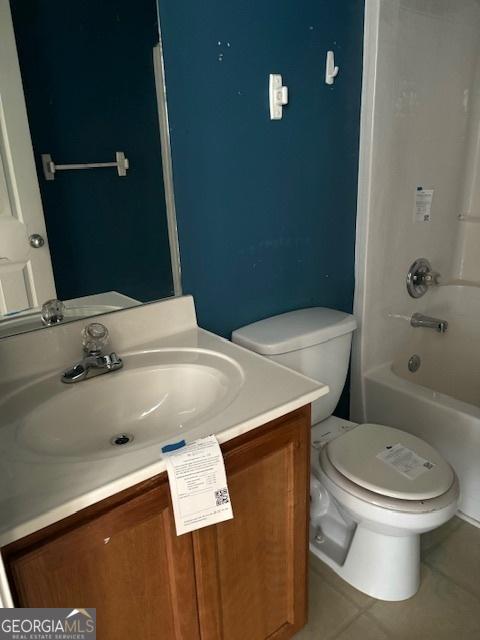 9515 Lakeview Rd, Union City, GA 30291 - bathroom featuring tile patterned flooring, vanity, toilet, and bathtub / shower combination