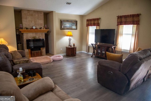 1351 Old Screven Rd, Jesup, GA 31545 - living area featuring vaulted ceiling, wood finished floors, baseboards, and a fireplace