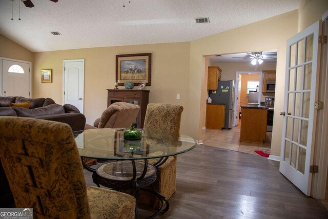 1351 Old Screven Rd, Jesup, GA 31545 - dining space featuring ceiling fan, lofted ceiling, light wood-type flooring, and a textured ceiling