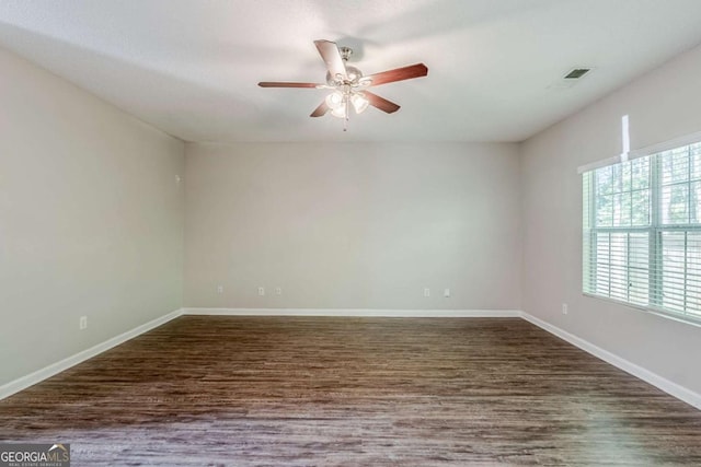 6285 Polar Fox Ct, Riverdale, GA 30296 - spare room with a ceiling fan and dark wood-type flooring