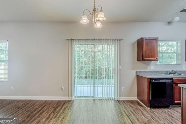 6285 Polar Fox Ct, Riverdale, GA 30296 - unfurnished dining area with light wood-style floors and a chandelier