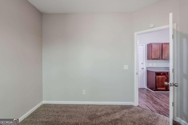 6285 Polar Fox Ct, Riverdale, GA 30296 - empty room with carpet floors and a smoke detector
