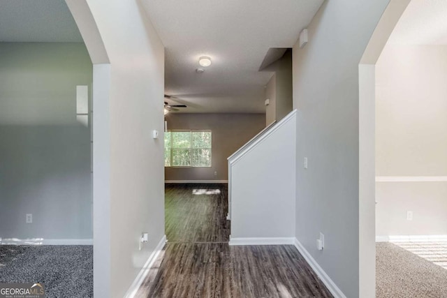 6285 Polar Fox Ct, Riverdale, GA 30296 - hall with arched walkways, wood finished floors, and stairs