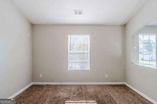 6285 Polar Fox Ct, Riverdale, GA 30296 - carpeted spare room featuring baseboards and arched walkways