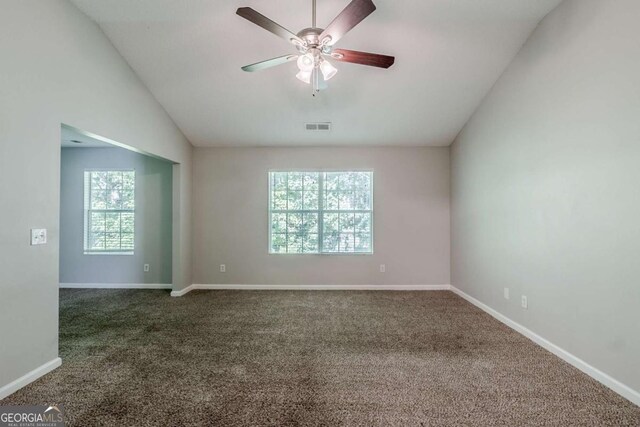 6285 Polar Fox Ct, Riverdale, GA 30296 - carpeted empty room with healthy amount of natural light, ceiling fan, and lofted ceiling