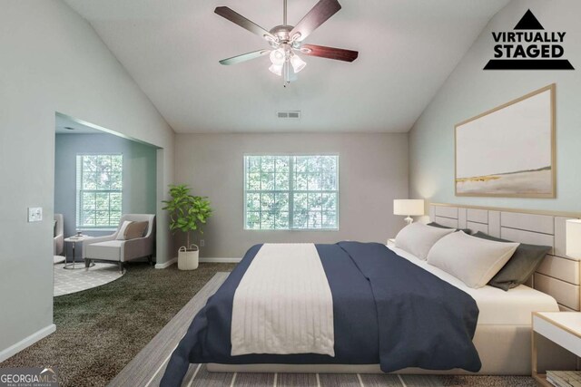 6285 Polar Fox Ct, Riverdale, GA 30296 - carpeted bedroom with vaulted ceiling and a ceiling fan