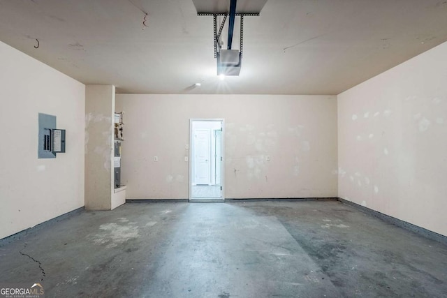 6285 Polar Fox Ct, Riverdale, GA 30296 - garage featuring electric panel and a garage door opener