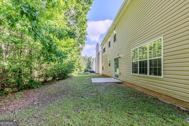6285 Polar Fox Ct, Riverdale, GA 30296 - view of green lawn featuring a patio area