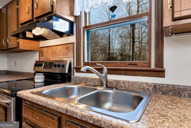 22 Ridge Haven Dr, Cleveland, GA 30528 - kitchen featuring stainless steel electric stove, under cabinet range hood, a sink, and brown cabinets