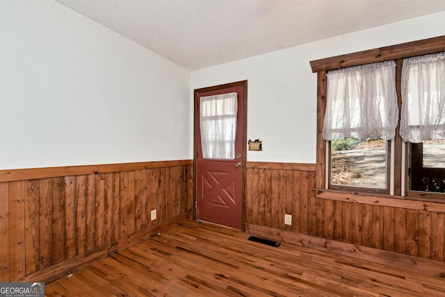 22 Ridge Haven Dr, Cleveland, GA 30528 - entryway with wainscoting, wood finished floors, and wooden walls