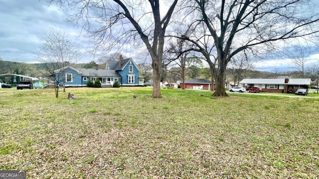 6 River St SW, Cave Spring, GA 30124 - view of green lawn featuring a detached carport