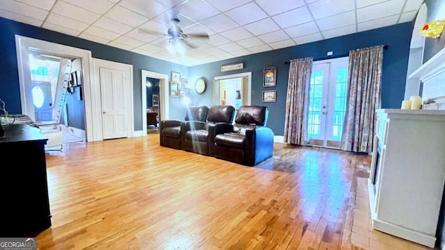6 River St SW, Cave Spring, GA 30124 - living area featuring wood finished floors, a paneled ceiling, ceiling fan, and baseboards