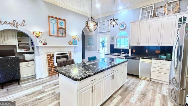 6 River St SW, Cave Spring, GA 30124 - kitchen with appliances with stainless steel finishes, ornamental molding, arched walkways, white cabinetry, and a textured ceiling
