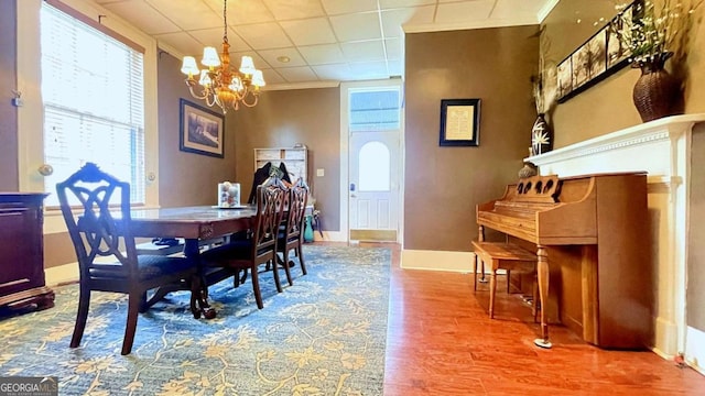 6 River St SW, Cave Spring, GA 30124 - dining area featuring a chandelier, wood finished floors, healthy amount of natural light, ornamental molding, and baseboards