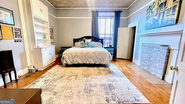 6 River St SW, Cave Spring, GA 30124 - bedroom featuring ornamental molding, wood finished floors, and baseboards