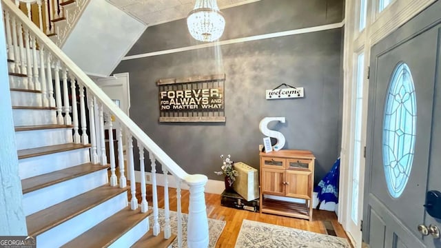 6 River St SW, Cave Spring, GA 30124 - foyer entrance featuring wood finished floors, a chandelier, stairs, and baseboards