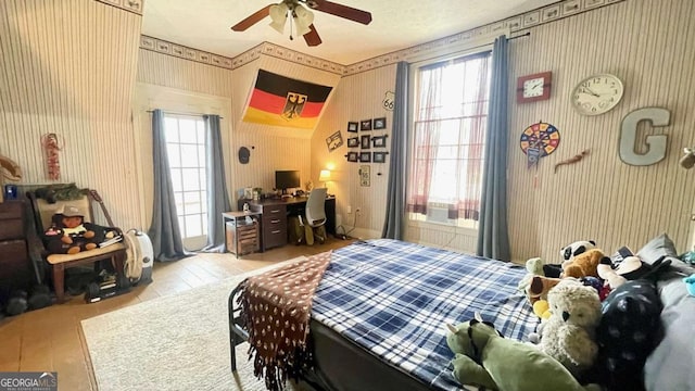 6 River St SW, Cave Spring, GA 30124 - bedroom with wallpapered walls, an office area, and wood finished floors