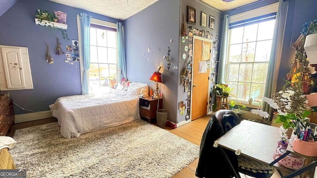 6 River St SW, Cave Spring, GA 30124 - bedroom featuring wood finished floors and a textured ceiling